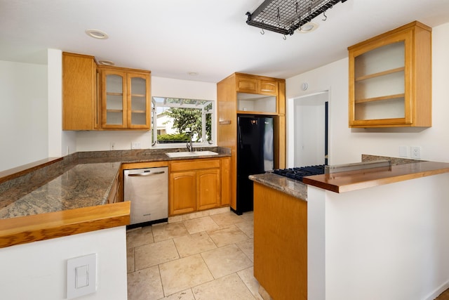 5003 Rhoads Ave, Santa Barbara, CA 93111 - kitchen featuring stainless steel dishwasher, freestanding refrigerator, a peninsula, glass insert cabinets, and brown cabinets