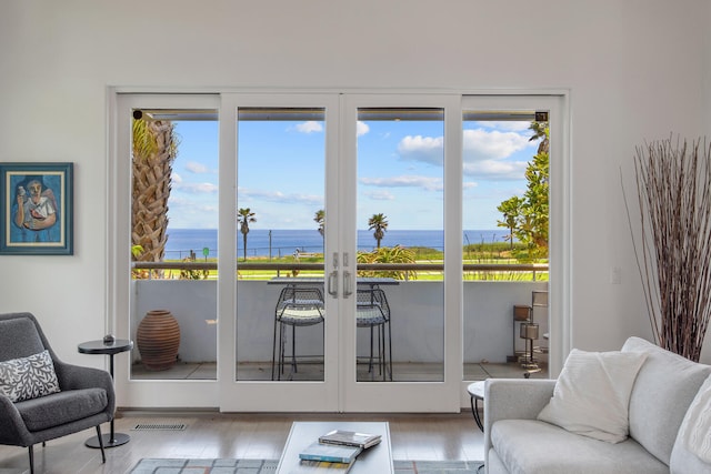 1312 Shoreline Dr, Santa Barbara, CA 93109 - doorway featuring a water view, wood finished floors, and french doors
