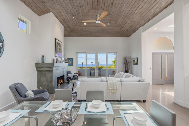1312 Shoreline Dr, Santa Barbara, CA 93109 - living room featuring high vaulted ceiling, wooden ceiling, healthy amount of natural light, a ceiling fan, and a fireplace