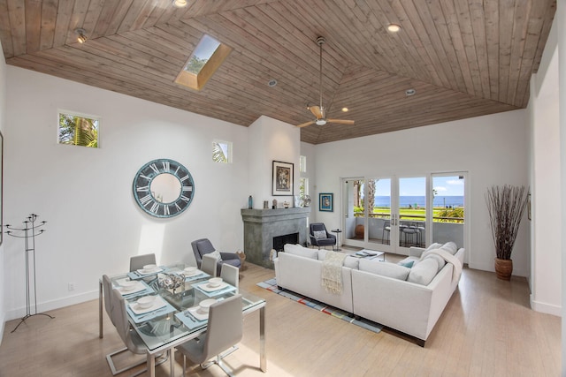 1312 Shoreline Dr, Santa Barbara, CA 93109 - living room featuring plenty of natural light, high vaulted ceiling, light wood finished floors, a premium fireplace, and recessed lighting