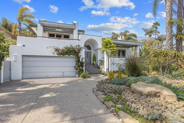 1312 Shoreline Dr, Santa Barbara, CA 93109 - view of front of house featuring driveway, stucco siding, and an attached garage