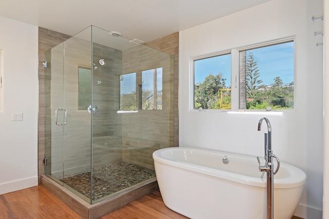 1312 Shoreline Dr, Santa Barbara, CA 93109 - full bathroom with a freestanding tub, wood finished floors, and a stall shower