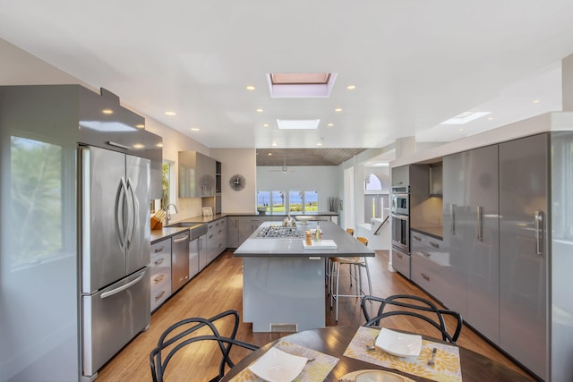 1312 Shoreline Dr, Santa Barbara, CA 93109 - kitchen with appliances with stainless steel finishes, modern cabinets, light wood-style floors, and recessed lighting