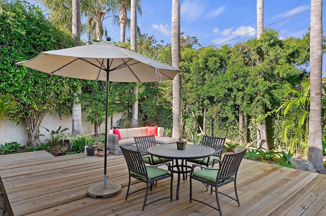 1312 Shoreline Dr, Santa Barbara, CA 93109 - wooden deck featuring outdoor dining area and view of scattered trees