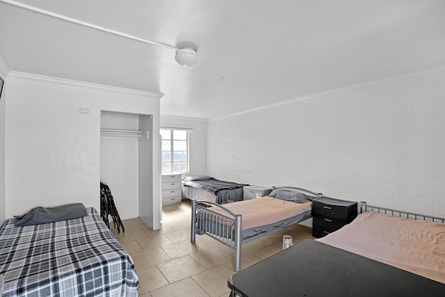 1324 N Broadway, Santa Maria, CA 93454 - bedroom with crown molding, light tile patterned floors, and concrete block wall