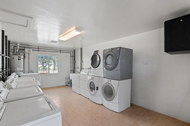 1324 N Broadway, Santa Maria, CA 93454 - community laundry featuring water heater, stacked washer / dryer, independent washer and dryer, and concrete block wall