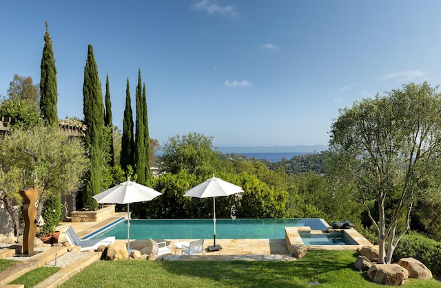 191 E Mountain Dr, Montecito, CA 93108 - view of pool featuring a pool with connected hot tub and a lawn