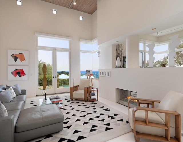 191 E Mountain Dr, Montecito, CA 93108 - living room with a high ceiling, a high end fireplace, and wooden ceiling
