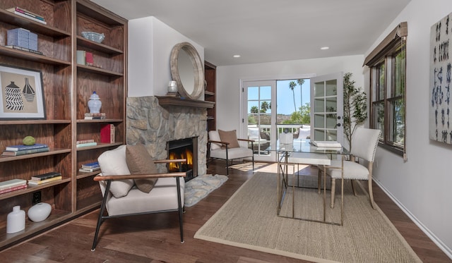 4530 Via Clarice, Santa Barbara, CA 93111 - living room with dark wood-style floors, a stone fireplace, and recessed lighting