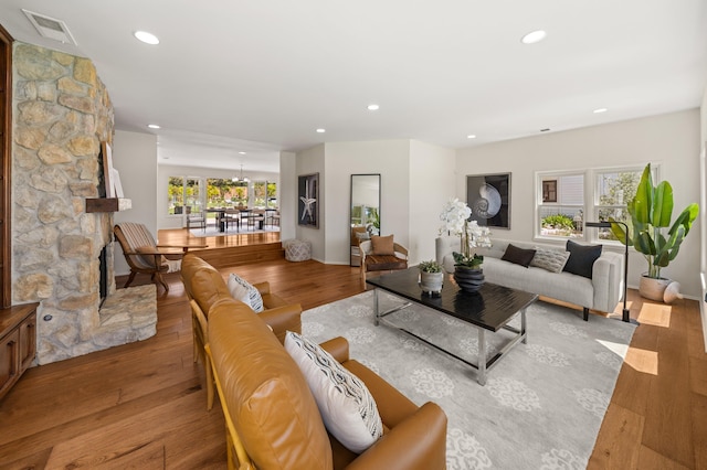 4530 Via Clarice, Santa Barbara, CA 93111 - living room with healthy amount of natural light, wood finished floors, recessed lighting, and a chandelier