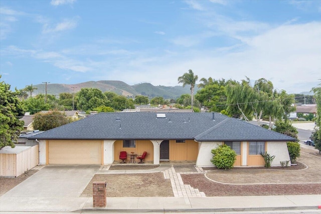 1300 E Airport Ave, Lompoc, CA 93436 - ranch-style house with a mountain view, a shingled roof, an attached garage, and concrete driveway