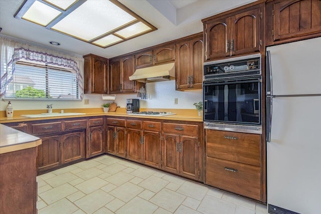 1300 E Airport Ave, Lompoc, CA 93436 - kitchen featuring white appliances, under cabinet range hood, and light countertops