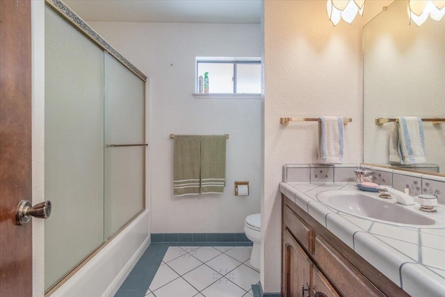 1300 E Airport Ave, Lompoc, CA 93436 - bathroom featuring tile patterned flooring, vanity, and enclosed tub / shower combo