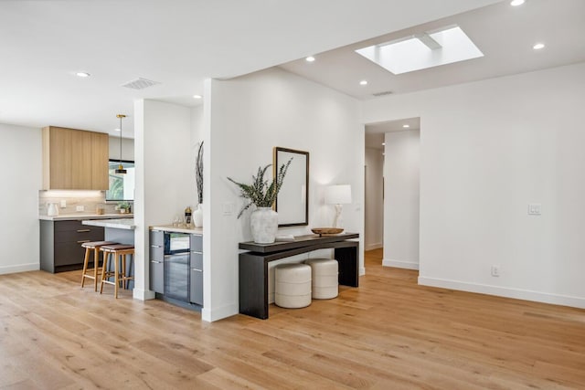 1412 Crestline Dr, Santa Barbara, CA 93105 - hallway featuring a skylight, light wood-type flooring, and recessed lighting