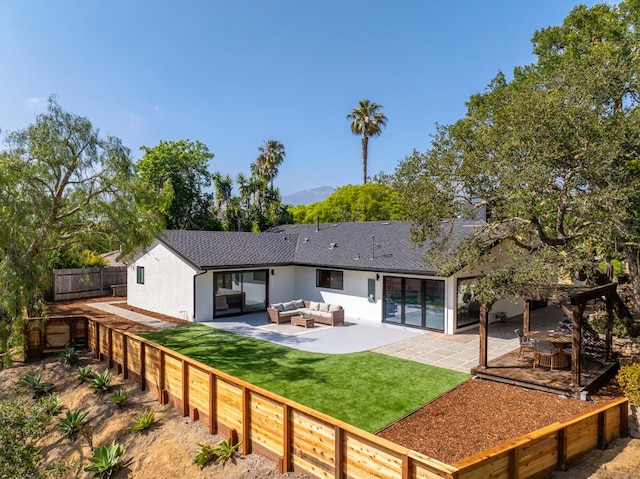 1412 Crestline Dr, Santa Barbara, CA 93105 - back of property with outdoor lounge area, a fenced backyard, stucco siding, and a patio