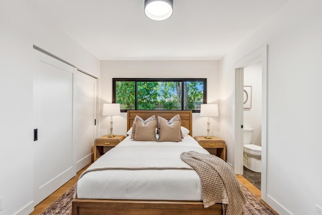 1412 Crestline Dr, Santa Barbara, CA 93105 - bedroom with ensuite bath, a closet, and light wood-style flooring