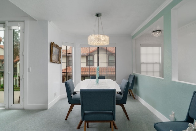 2206 Martinique Ln, Oxnard, CA 93035 - carpeted dining area featuring a chandelier and ornamental molding