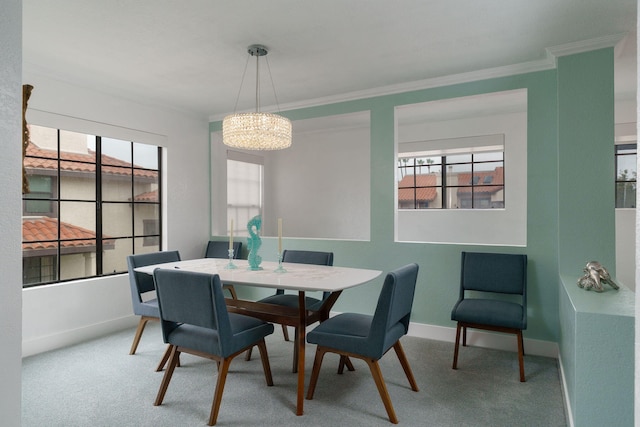 2206 Martinique Ln, Oxnard, CA 93035 - dining area featuring ornamental molding, healthy amount of natural light, carpet flooring, and a chandelier