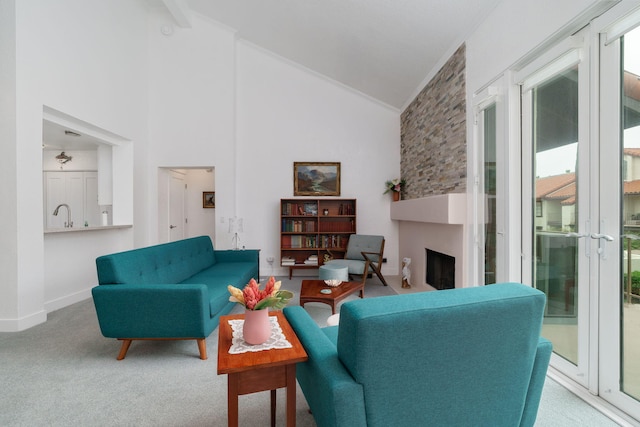 2206 Martinique Ln, Oxnard, CA 93035 - carpeted living area featuring ornamental molding, vaulted ceiling, and a fireplace