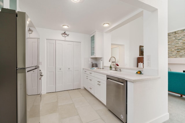 2206 Martinique Ln, Oxnard, CA 93035 - kitchen featuring dishwasher, refrigerator, glass insert cabinets, light countertops, and white cabinets