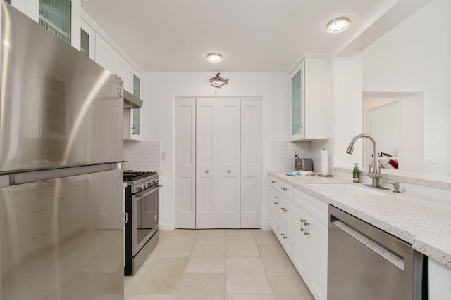 2206 Martinique Ln, Oxnard, CA 93035 - kitchen featuring stainless steel appliances, backsplash, and white cabinets