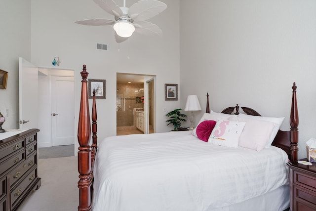 2206 Martinique Ln, Oxnard, CA 93035 - bedroom with a high ceiling, light colored carpet, ensuite bathroom, and ceiling fan