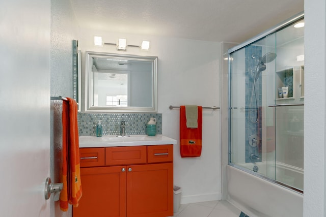 2206 Martinique Ln, Oxnard, CA 93035 - full bath with vanity, tile patterned floors, enclosed tub / shower combo, and decorative backsplash