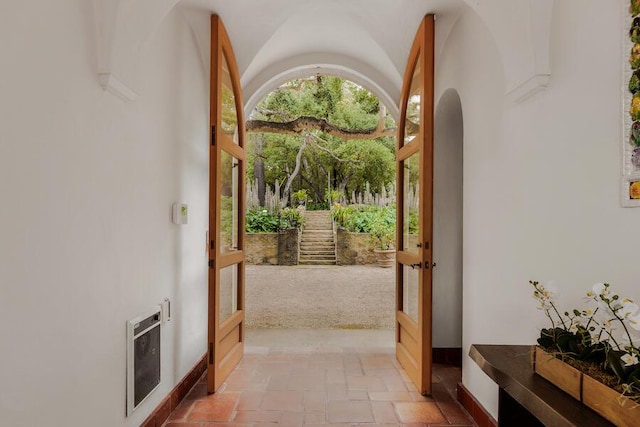 405 Toro Canyon Rd, Carpinteria, CA 93013 - doorway to outside featuring heating unit, stone tile floors, and french doors