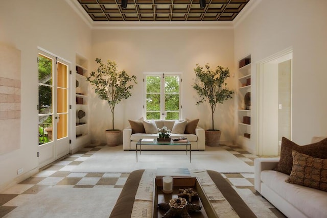 405 Toro Canyon Rd, Carpinteria, CA 93013 - living area with a towering ceiling, built in features, and crown molding