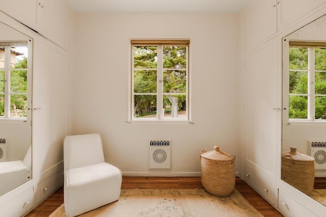 405 Toro Canyon Rd, Carpinteria, CA 93013 - sitting room featuring wood finished floors, healthy amount of natural light, and heating unit