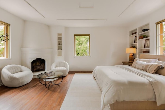 405 Toro Canyon Rd, Carpinteria, CA 93013 - bedroom featuring wood finished floors and a fireplace