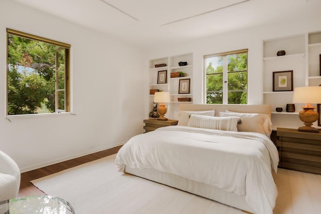 405 Toro Canyon Rd, Carpinteria, CA 93013 - bedroom with multiple windows and wood finished floors
