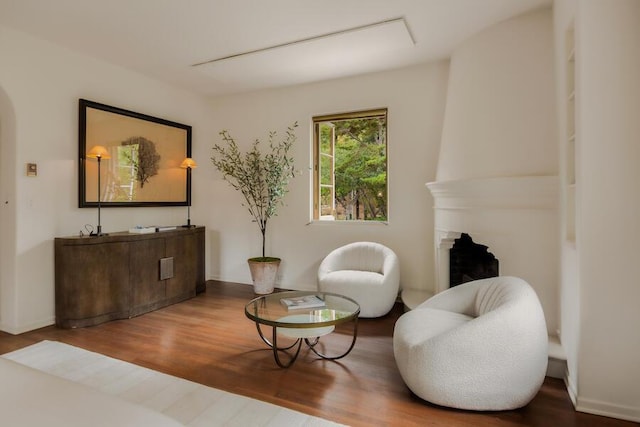 405 Toro Canyon Rd, Carpinteria, CA 93013 - sitting room with wood finished floors and a fireplace