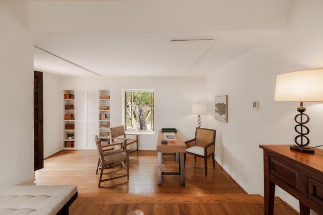 405 Toro Canyon Rd, Carpinteria, CA 93013 - living area featuring light wood-style flooring and built in features
