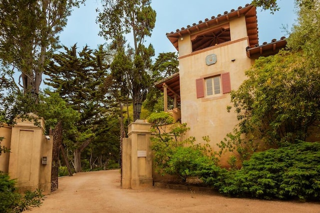 405 Toro Canyon Rd, Carpinteria, CA 93013 - view of side of home featuring stucco siding