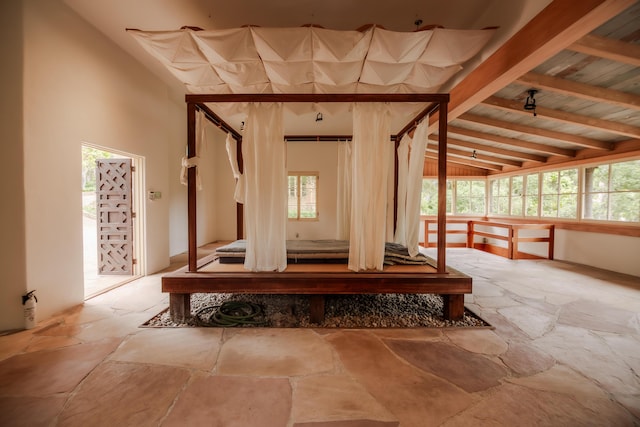 405 Toro Canyon Rd, Carpinteria, CA 93013 - corridor featuring stone floors, healthy amount of natural light, and beamed ceiling