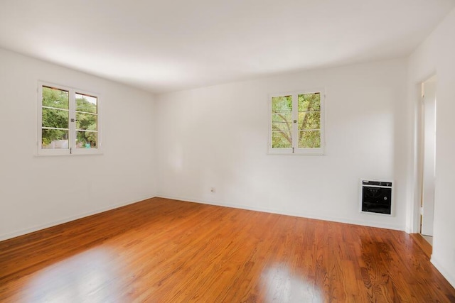 405 Toro Canyon Rd, Carpinteria, CA 93013 - spare room featuring heating unit and wood finished floors