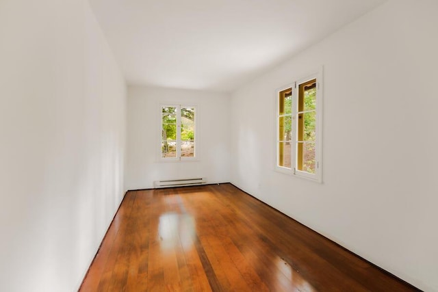 405 Toro Canyon Rd, Carpinteria, CA 93013 - empty room featuring baseboard heating, plenty of natural light, and hardwood / wood-style flooring