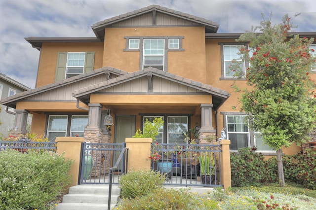 6607 Fathom Way, Goleta, CA 93117 - craftsman inspired home featuring a fenced front yard, board and batten siding, and covered porch
