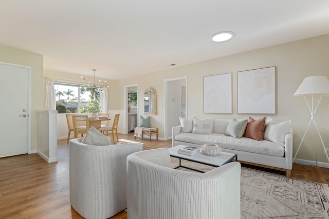 3639 San Remo Dr Unit 15, Santa Barbara, CA 93105 - living room with a chandelier and light wood-type flooring