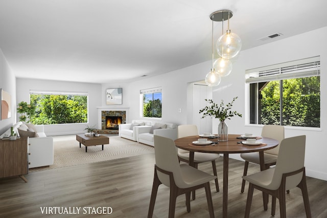 740 Alisal Rd, Solvang, CA 93463 - dining area featuring wood finished floors and a stone fireplace