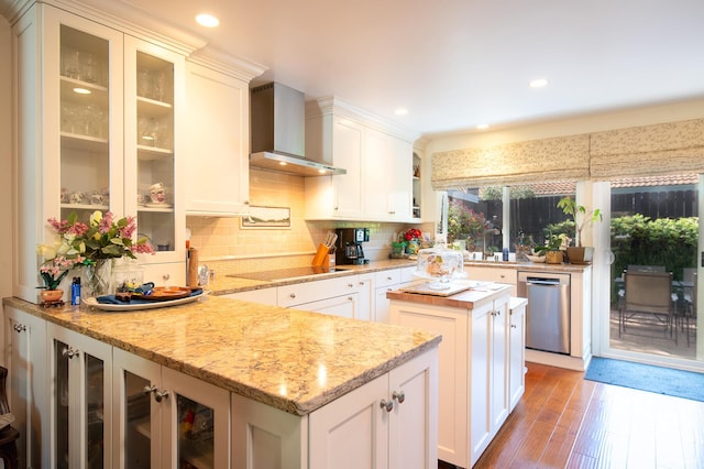 23 La Cumbre Cir, Santa Barbara, CA 93105 - kitchen featuring wall chimney exhaust hood, hardwood / wood-style flooring, stainless steel dishwasher, white cabinetry, and decorative backsplash