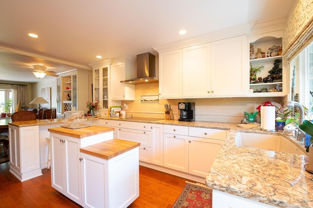 23 La Cumbre Cir, Santa Barbara, CA 93105 - kitchen featuring wooden counters, wall chimney exhaust hood, open shelves, tasteful backsplash, and electric stovetop
