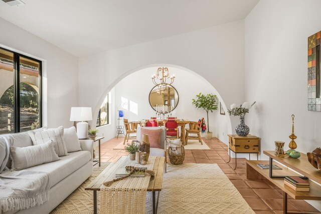 80 Bobcat Springs Rd, Buellton, CA 93427 - tiled living room with arched walkways and a chandelier