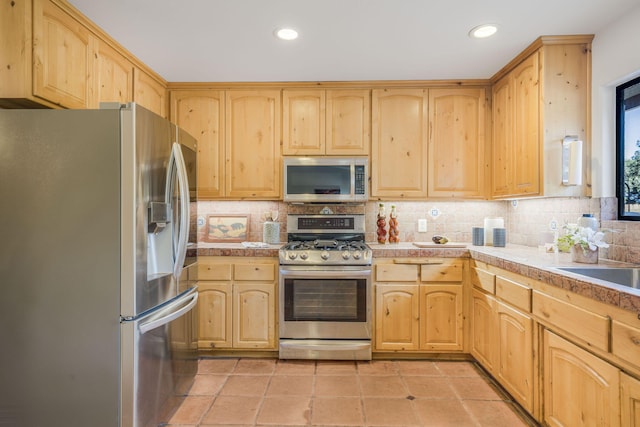 80 Bobcat Springs Rd, Buellton, CA 93427 - kitchen with stainless steel appliances, light brown cabinets, decorative backsplash, recessed lighting, and light tile patterned floors