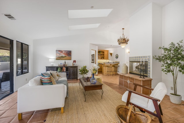 80 Bobcat Springs Rd, Buellton, CA 93427 - living area featuring a skylight, tile patterned floors, a chandelier, and high vaulted ceiling