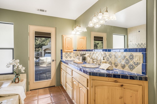 80 Bobcat Springs Rd, Buellton, CA 93427 - full bathroom with decorative backsplash, double vanity, tile patterned floors, and a bathtub