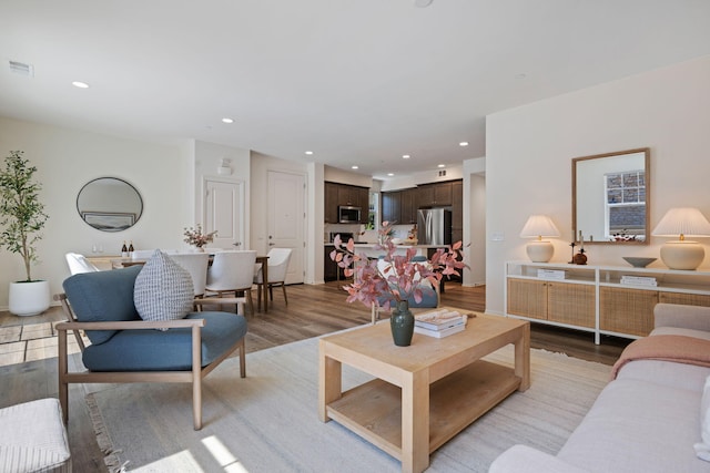 6594 Pipeline Pl, Goleta, CA 93117 - living room with light wood-style flooring and recessed lighting