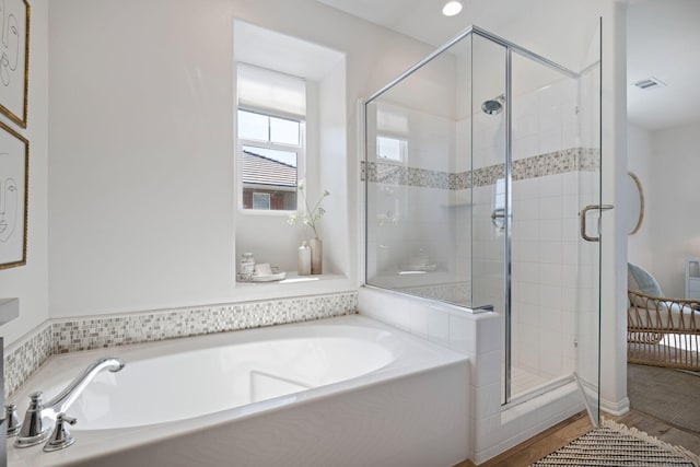 6594 Pipeline Pl, Goleta, CA 93117 - bathroom featuring a bath, a shower stall, and wood finished floors