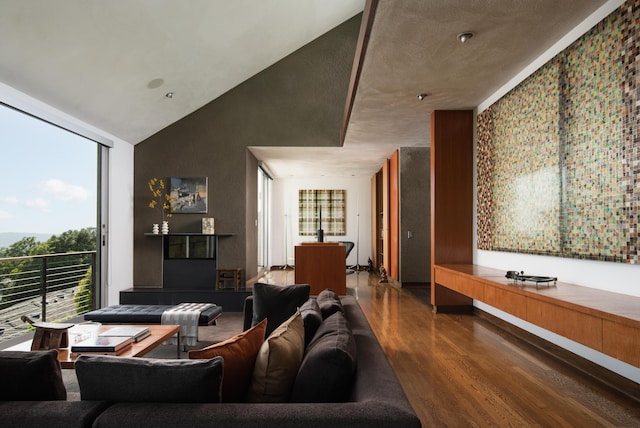 1944 Eucalyptus Hill Rd, Santa Barbara, CA 93108 - living room with wood finished floors, plenty of natural light, floor to ceiling windows, and high vaulted ceiling